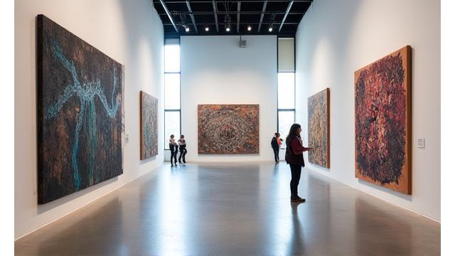 Modern art installations inside a brightly lit gallery space.